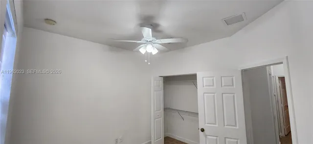 an empty room with a bathroom