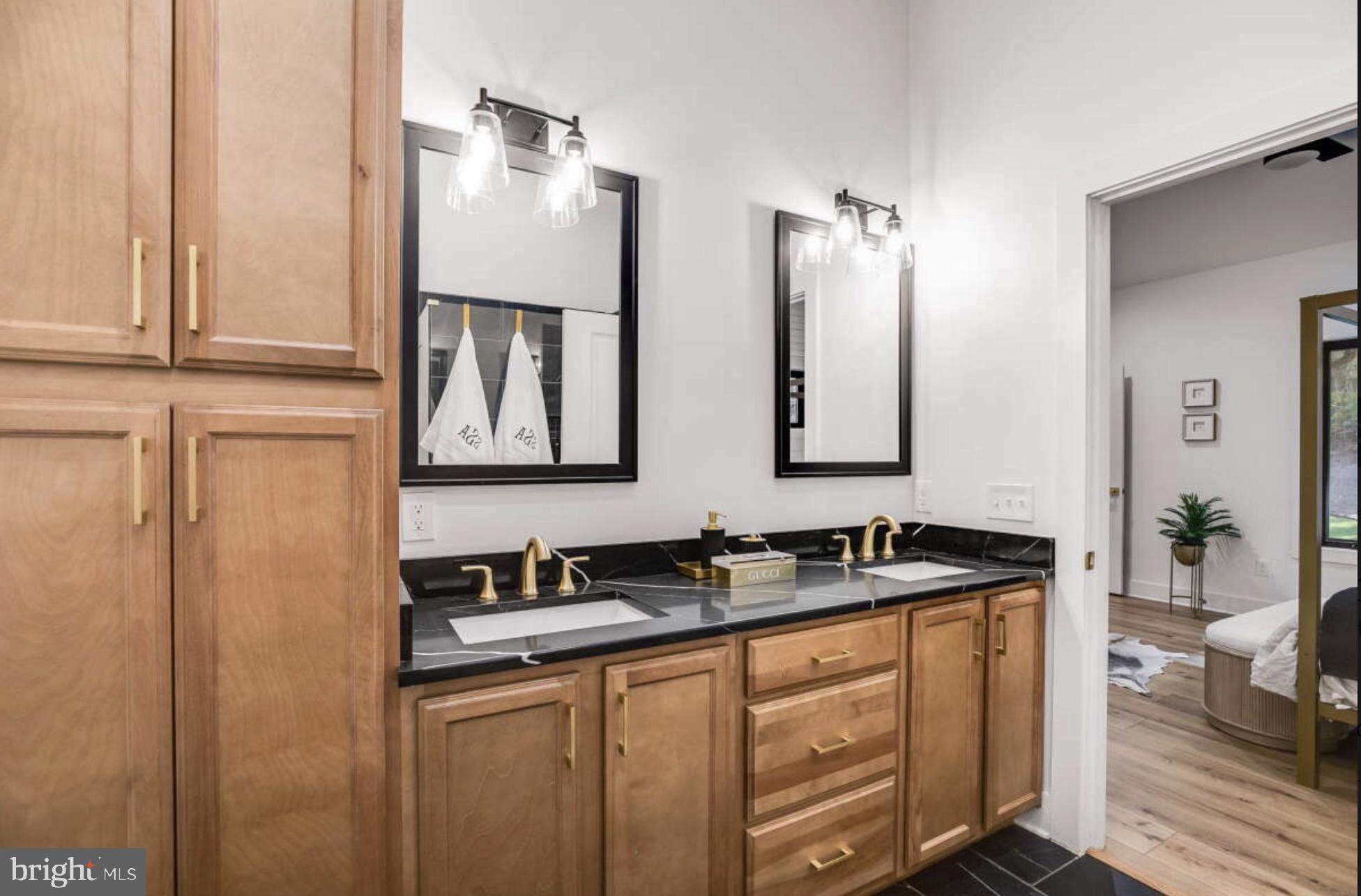 1440 Drummer Hill Road Front Royal, VA 22630 - Photo 27 of 58 a bathroom with double sink and a mirror