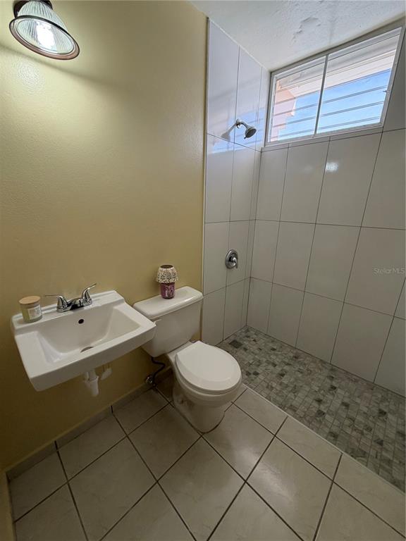1 St Rio Grande, Unit B6 Rio Grande, PR 00745 - Photo 30 of 47 a bathroom with a sink toilet and shower