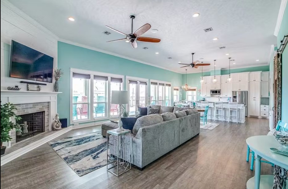 922 Palm Ridge Drive Crystal Beach, TX 77650 - Photo 3 of 17 a living room with fireplace furniture and a flat screen tv