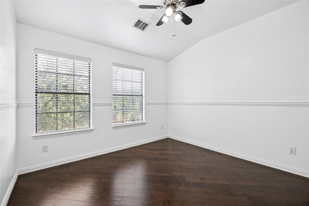 1503 Biltmore Lane Irving, TX 75063 - Photo 16 of 34 a view of a room with wooden floor and windows