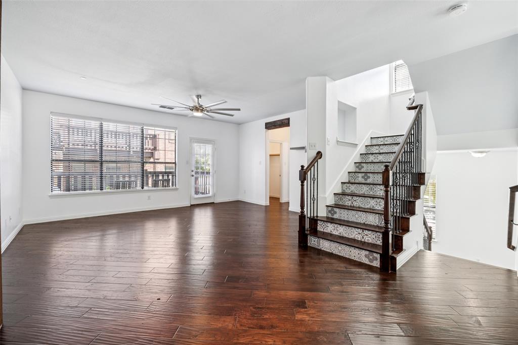 1503 Biltmore Lane Irving, TX 75063 - Photo 23 of 34 wooden floor in an empty room with a window