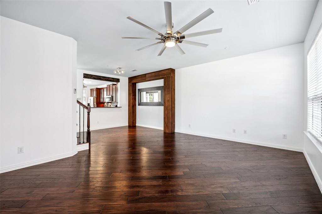 1503 Biltmore Lane Irving, TX 75063 - Photo 25 of 34 an empty room with wooden floor and windows