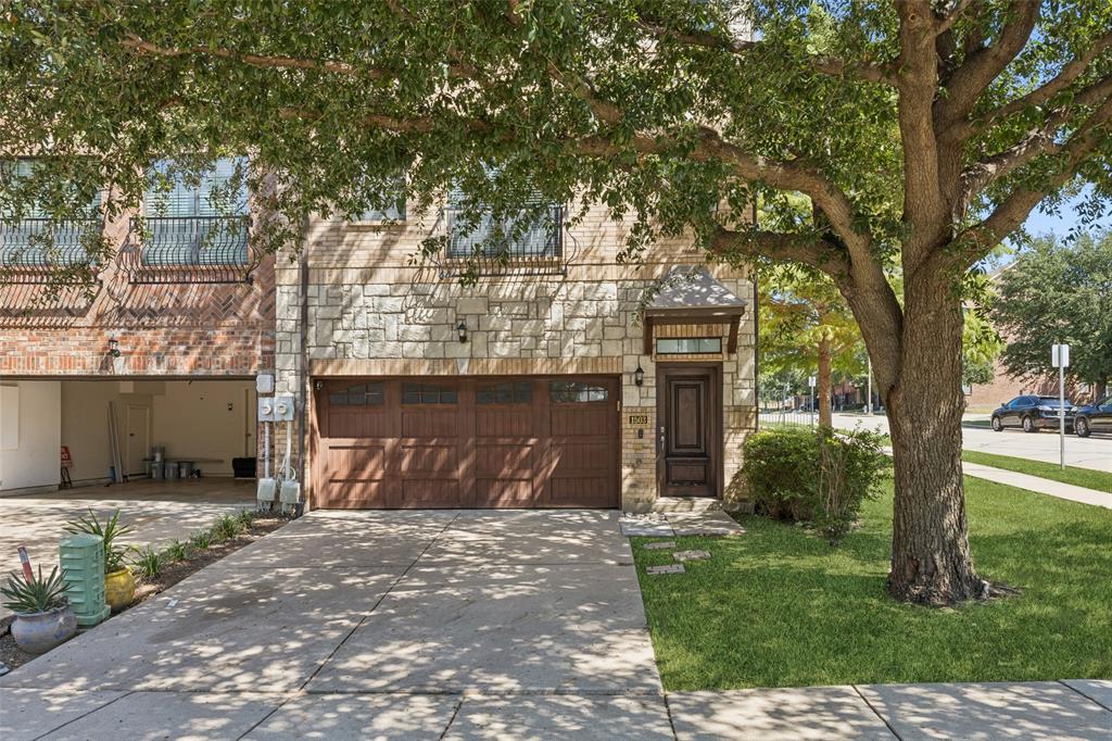 1503 Biltmore Lane Irving, TX 75063 - Photo 29 of 34 a front view of a house with a garden and trees