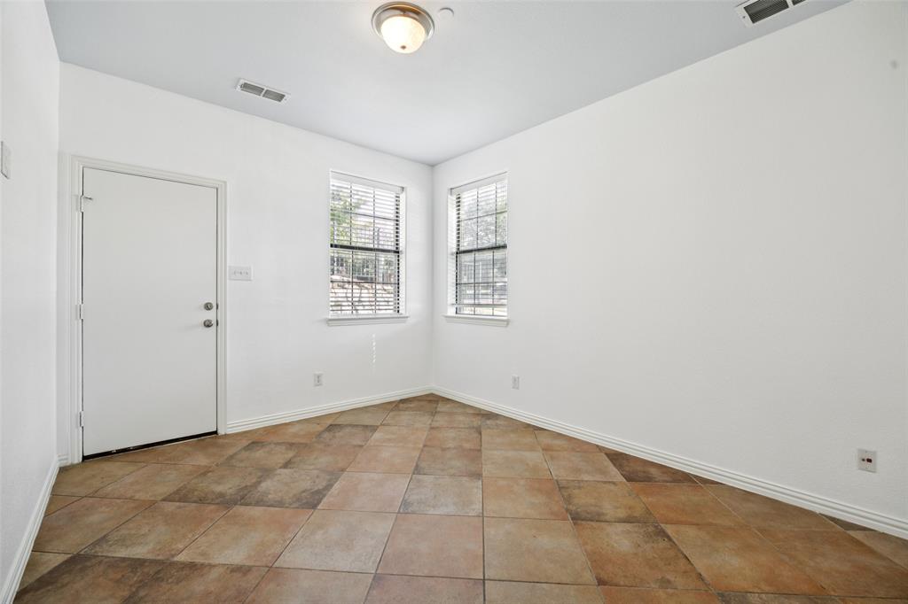 1503 Biltmore Lane Irving, TX 75063 - Photo 5 of 34 an empty room with windows