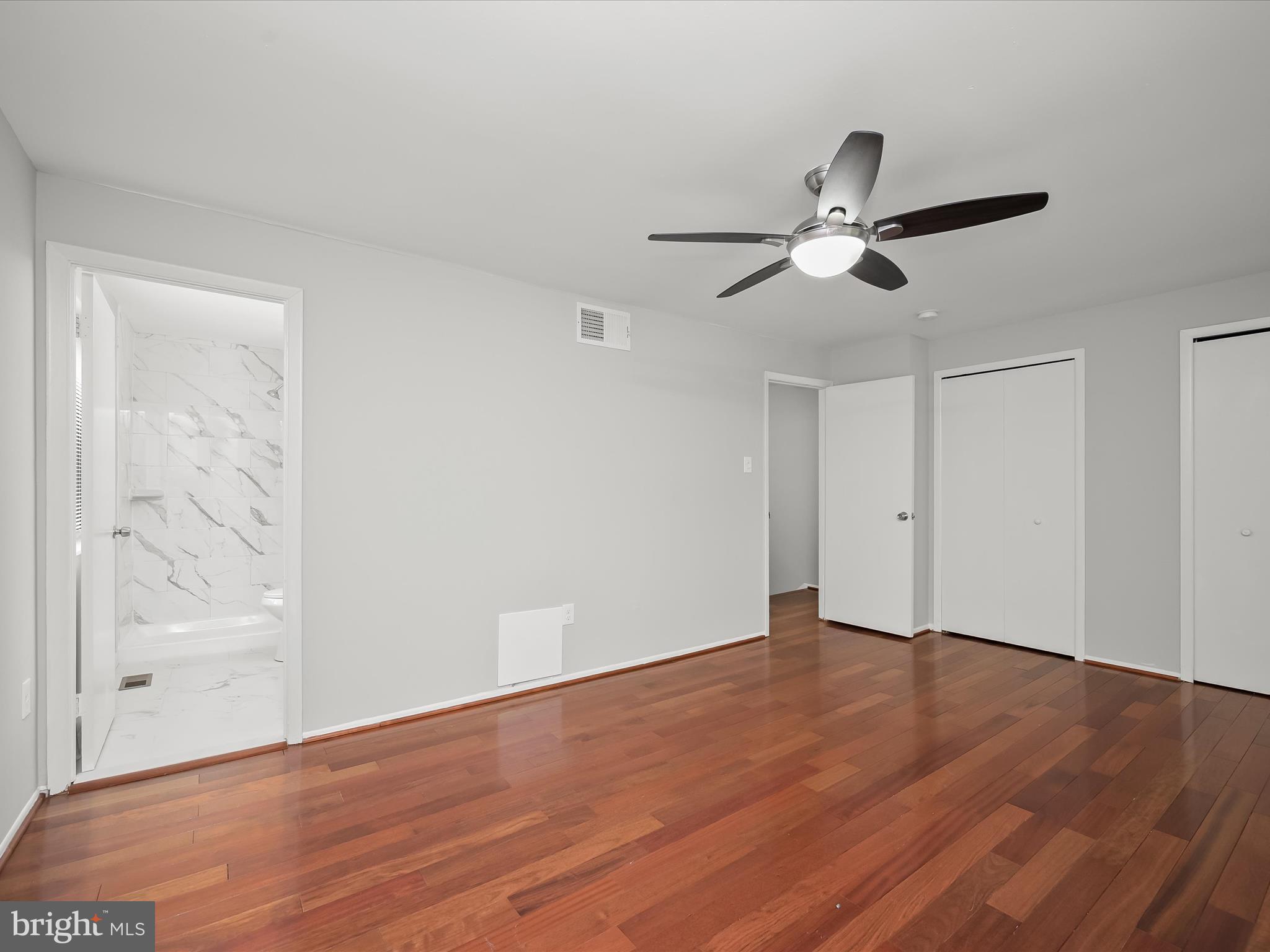 7106 Winter Rose Path Columbia, MD 21045 - Photo 18 of 50 a view of an empty room with wooden floor