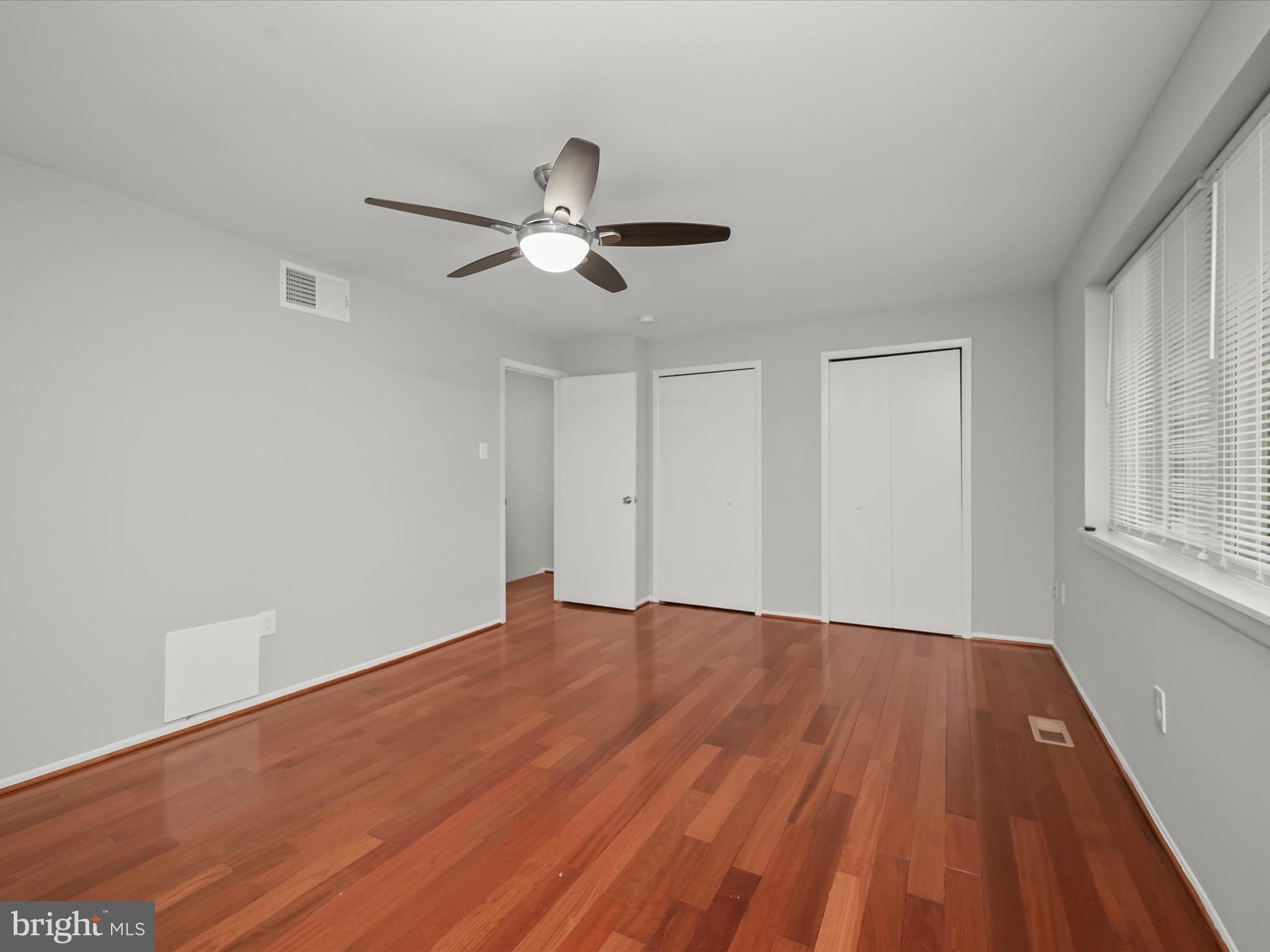 7106 Winter Rose Path Columbia, MD 21045 - Photo 20 of 50 a view of an empty room with window and wooden floor