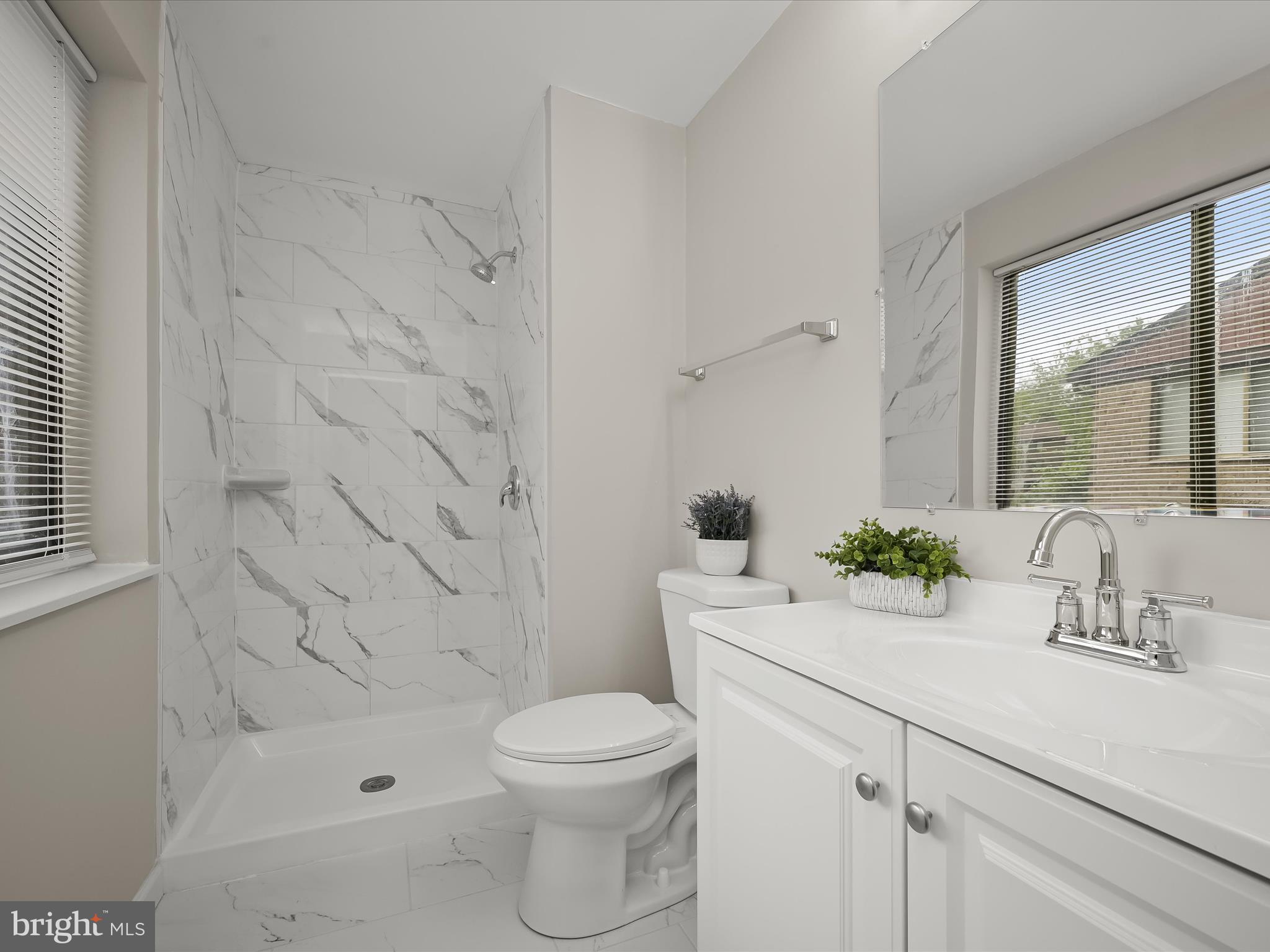 7106 Winter Rose Path Columbia, MD 21045 - Photo 21 of 50 a bathroom with a sink a toilet and shower