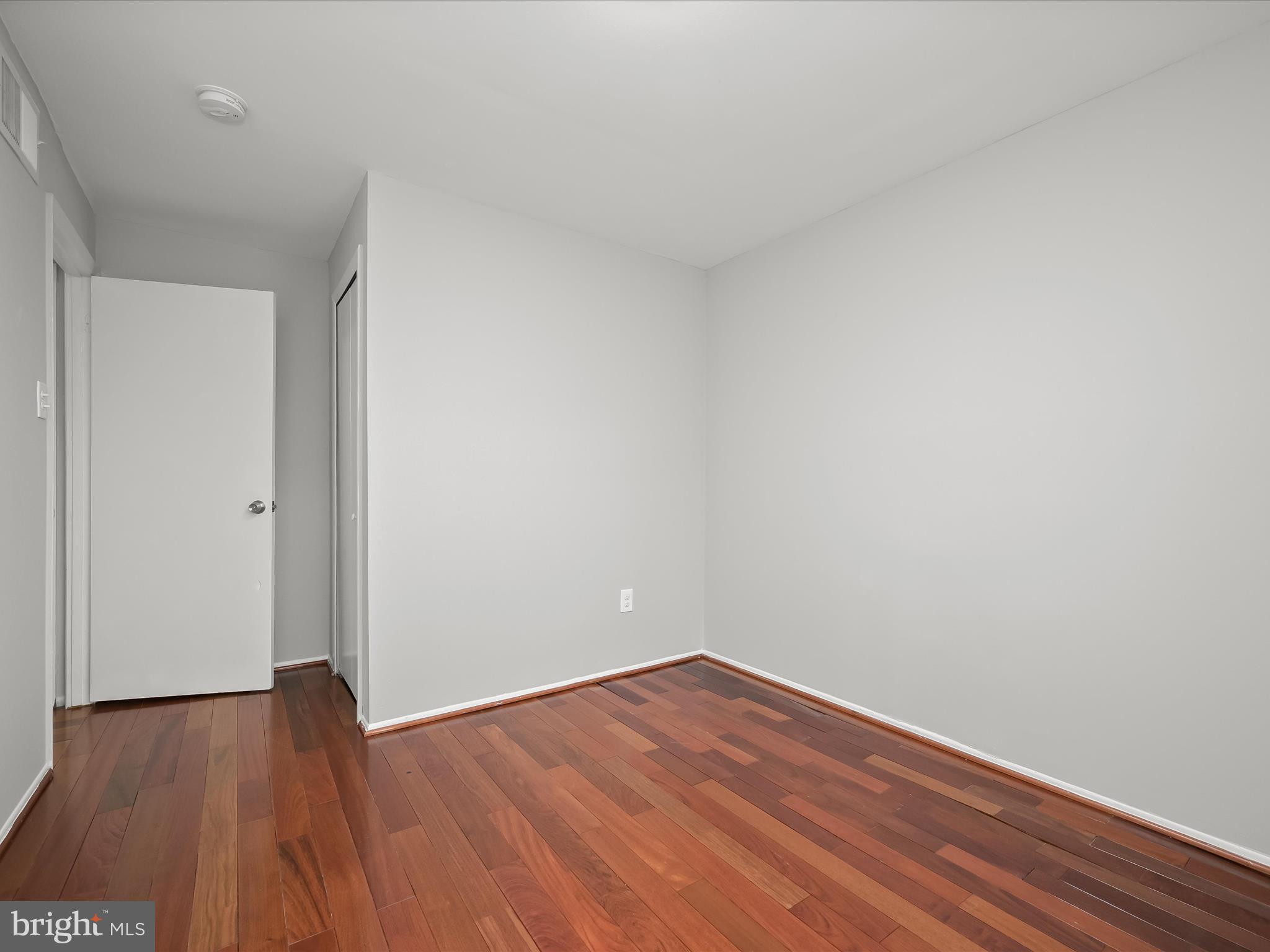 7106 Winter Rose Path Columbia, MD 21045 - Photo 26 of 50 a view of an empty room with wooden floor