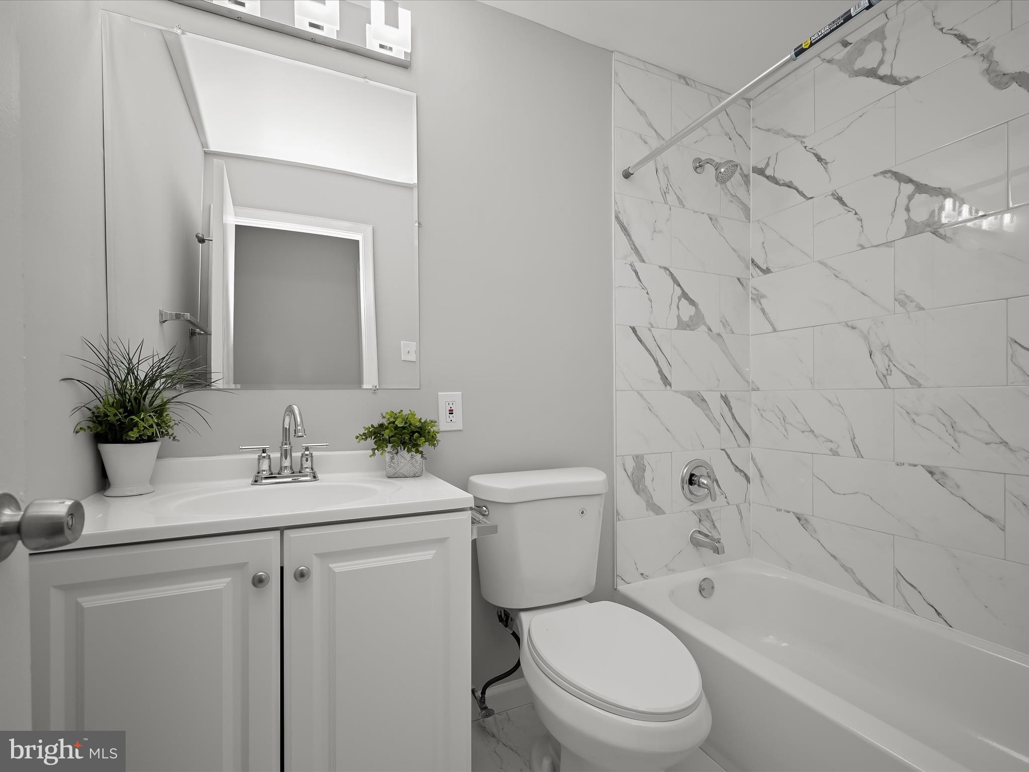 7106 Winter Rose Path Columbia, MD 21045 - Photo 28 of 50 a bathroom with a sink a toilet and shower