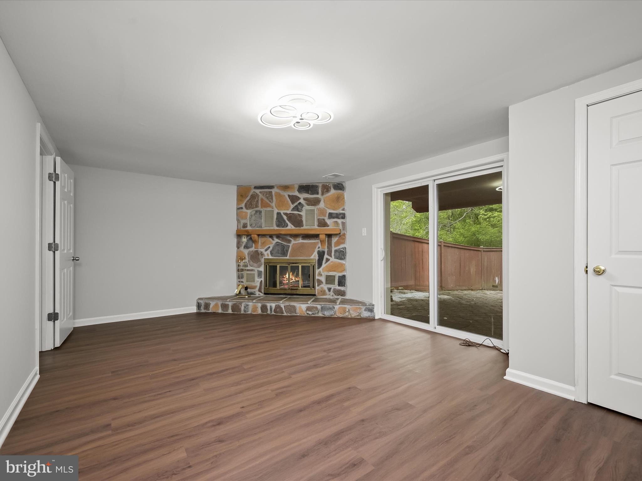 7106 Winter Rose Path Columbia, MD 21045 - Photo 30 of 50 an empty room with wooden floor and windows