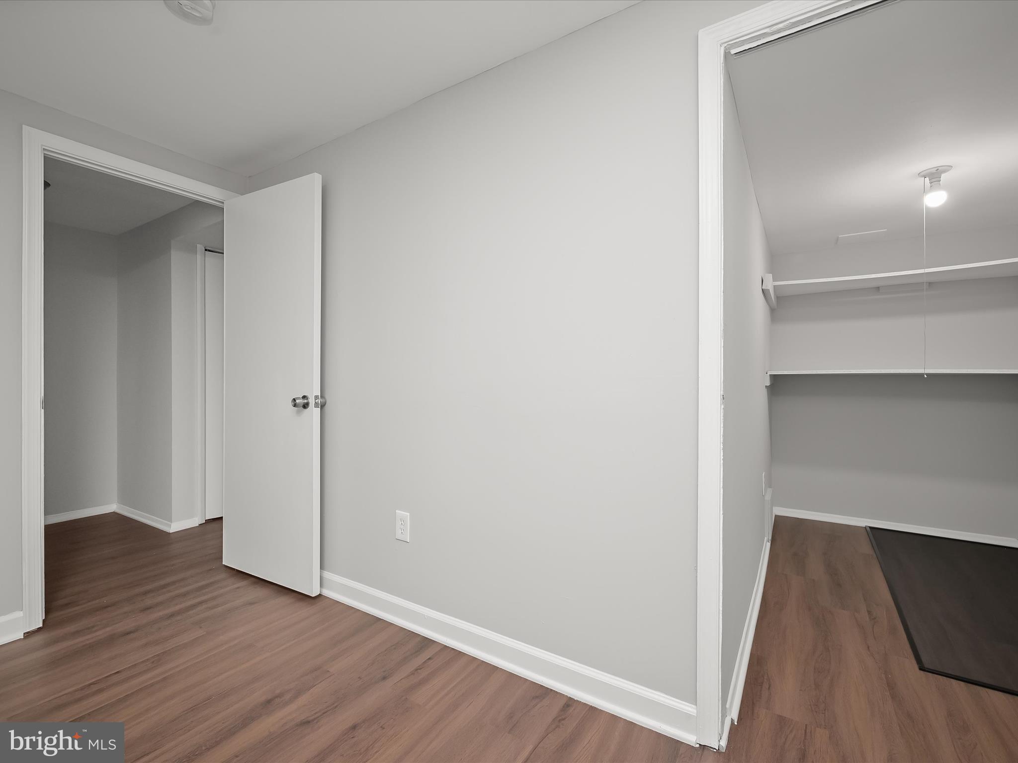 7106 Winter Rose Path Columbia, MD 21045 - Photo 34 of 50 a view of an empty room with wooden floor