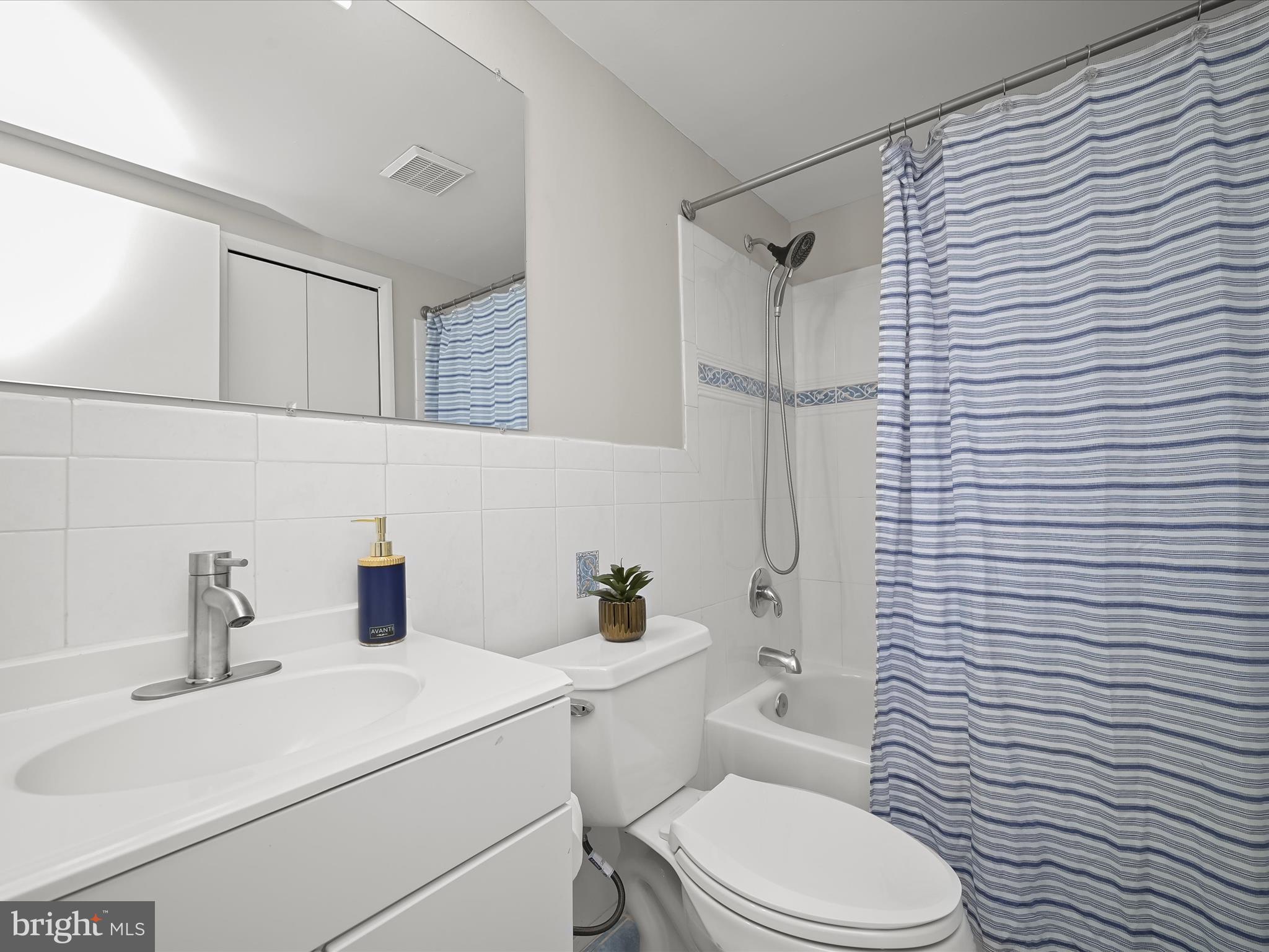 7106 Winter Rose Path Columbia, MD 21045 - Photo 35 of 50 a bathroom with a sink a toilet and shower