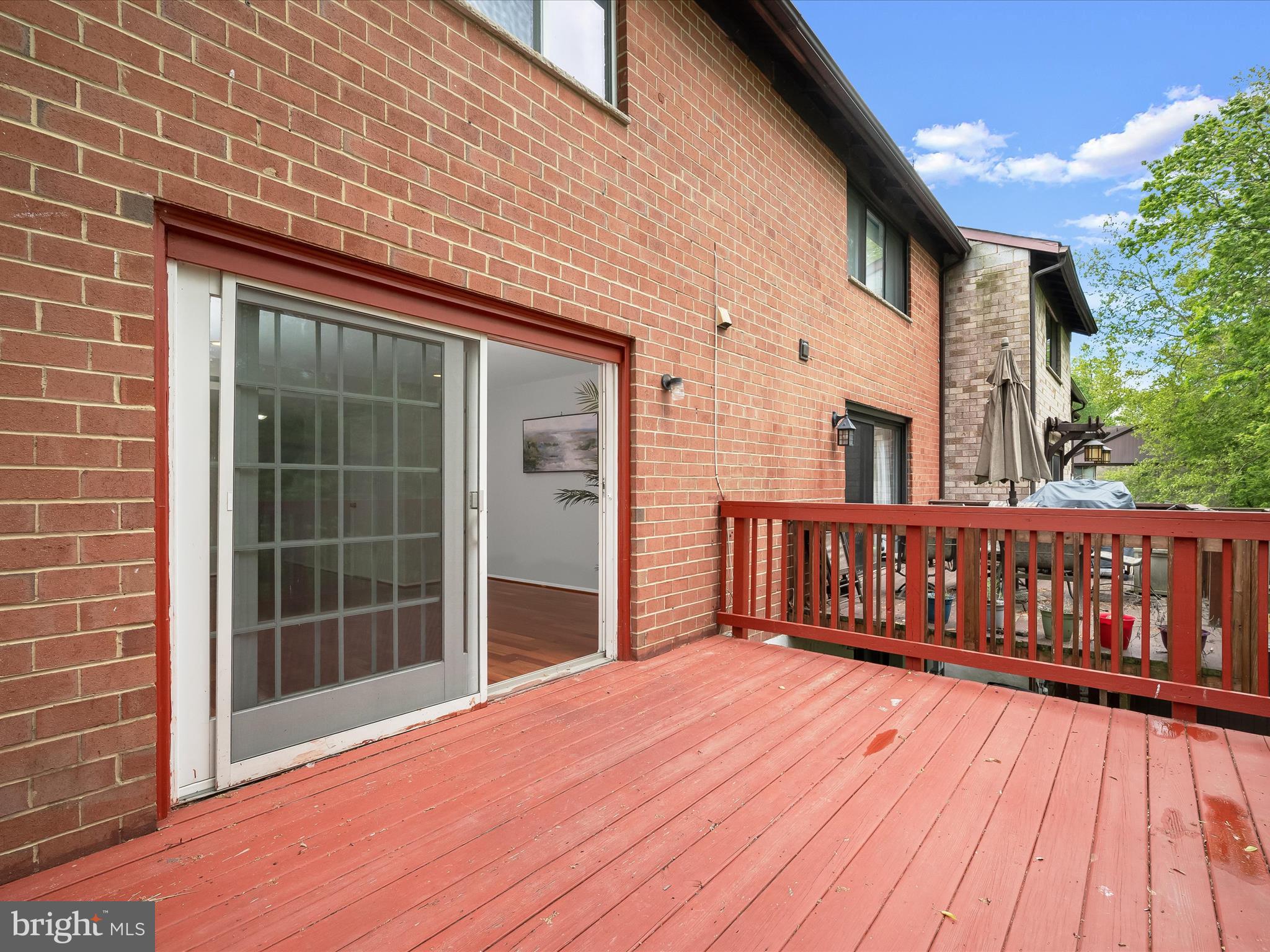 7106 Winter Rose Path Columbia, MD 21045 - Photo 41 of 50 a view of backyard with a deck and wooden floor