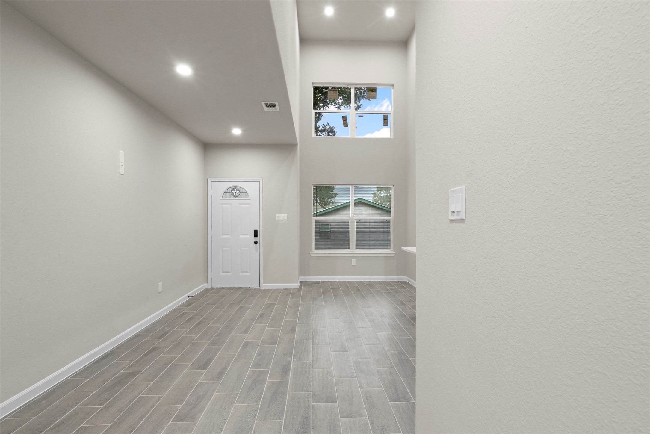 11763 White Cedar Street Willis, TX 77318 - Photo 8 of 22 View of front door with gorgeous natural lighting