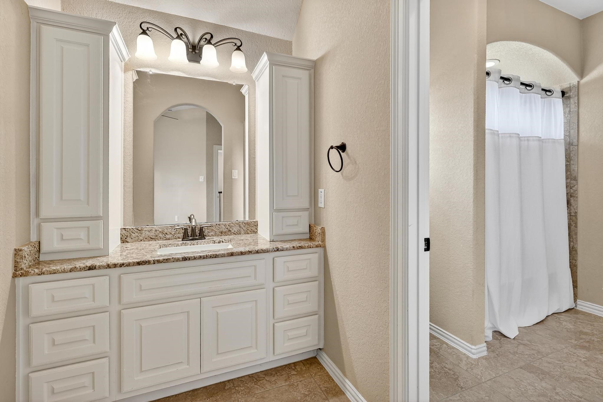 25803 Heritage Maple Drive Spring, TX 77389 - Photo 30 of 46 a bathroom with a sink mirror and vanity