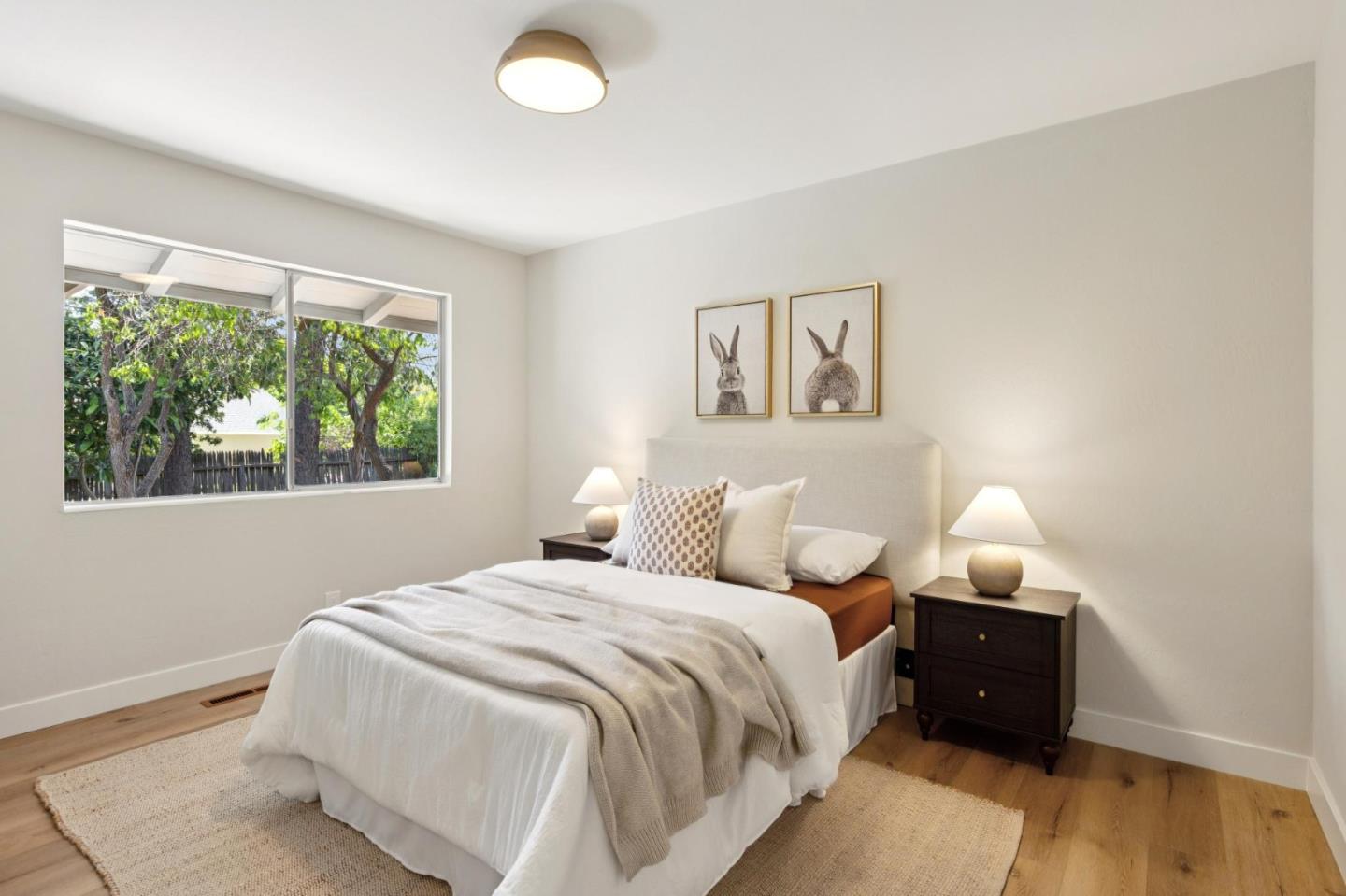 755 Santa Rita Avenue Los Altos, CA 94022 - Photo 32 of 50 a bedroom with a bed and wooden floor