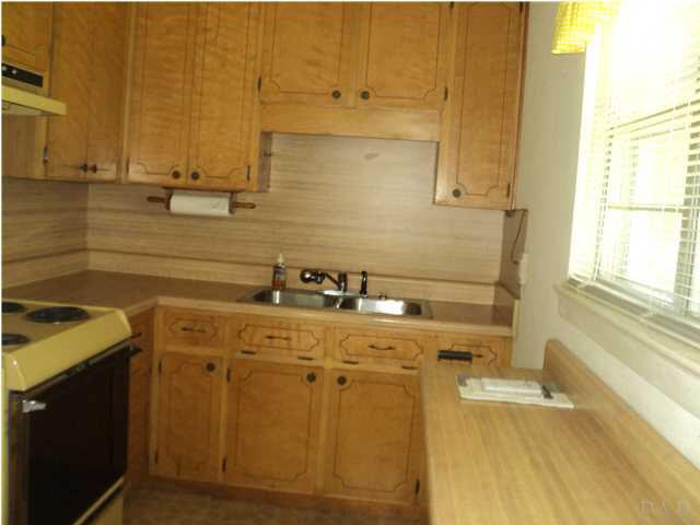 131 Vanderbilt Road Pensacola, FL 32506 - Photo 9 of 9 Wood cabinets, refrigerator, range included in this eat in kitchen
