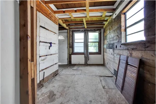 a view of an empty room with a window