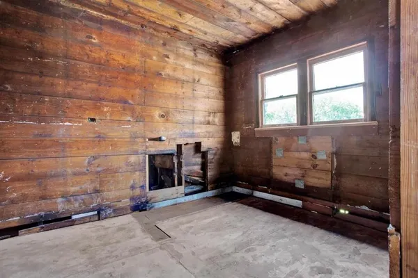 a bathroom with a tub sink and a window
