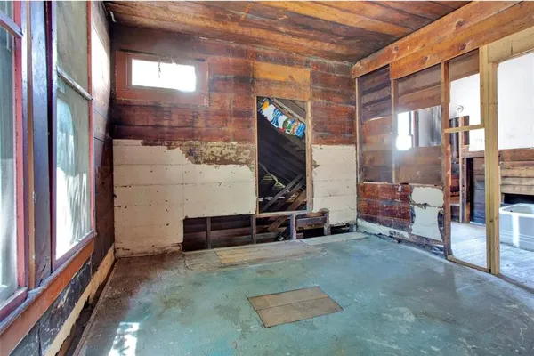 a view of an empty room with a window