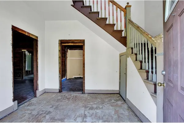a view of staircase with lots of frames and stairs