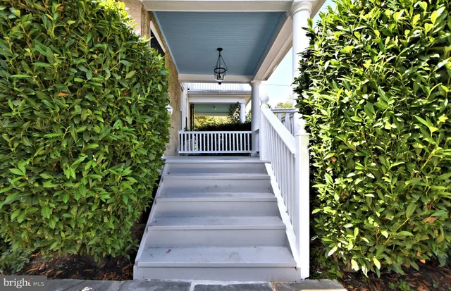 a view of a balcony with wooden floor