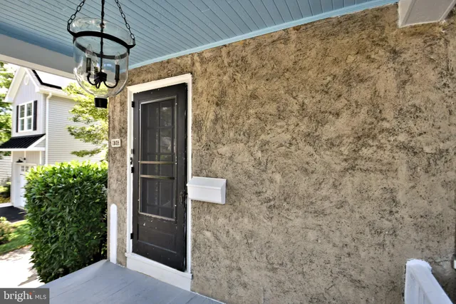 a kitchen with a sink a refrigerator and window