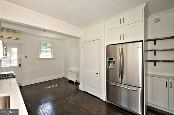 a kitchen with stainless steel appliances a sink stove and refrigerator