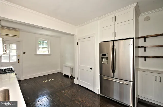 a kitchen with stainless steel appliances a sink stove and refrigerator