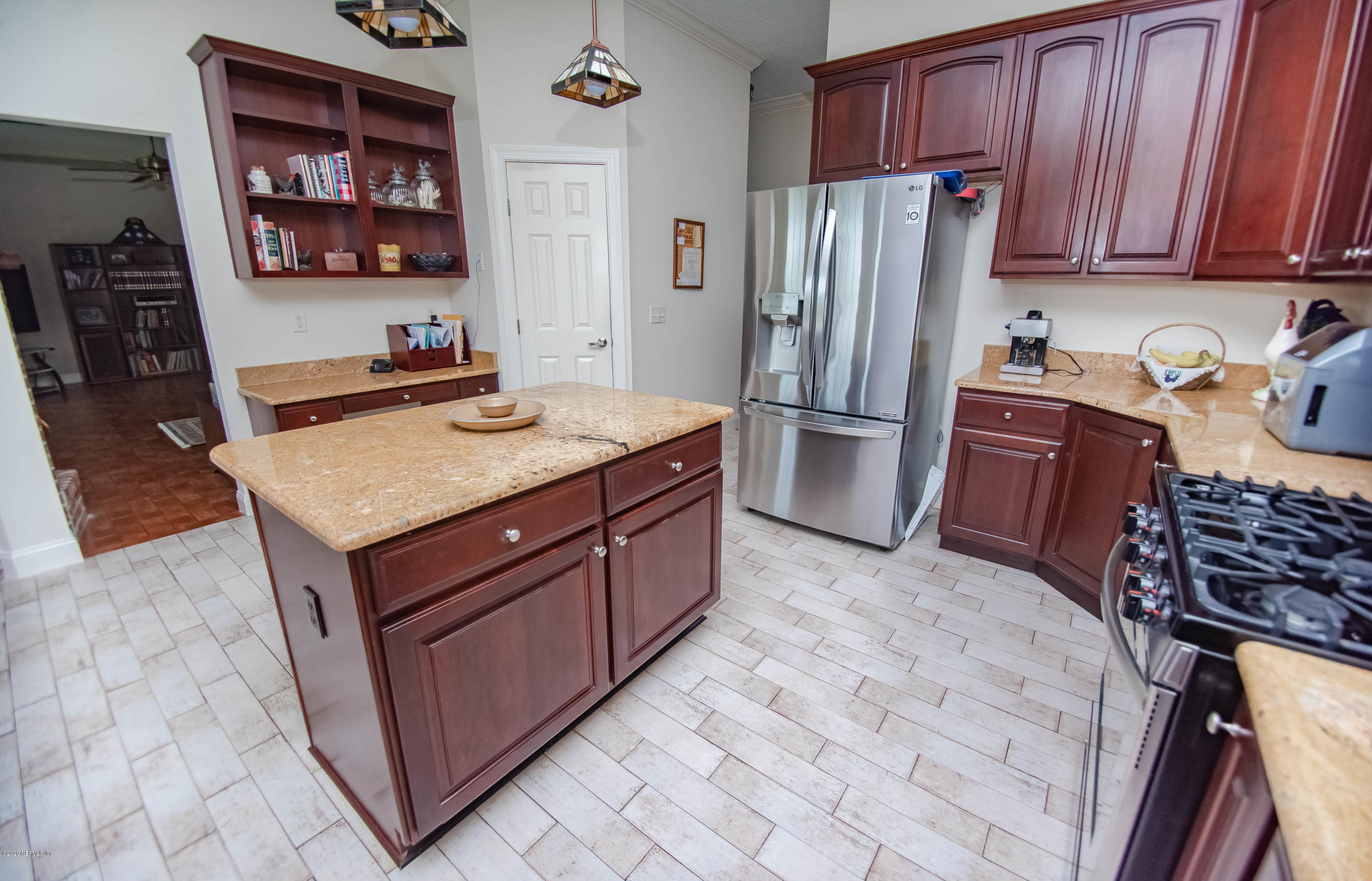 8219 Mud Lake Road Macclenny, FL 32063 - Photo 13 of 63 a kitchen with stainless steel appliances granite countertop a refrigerator stove and sink
