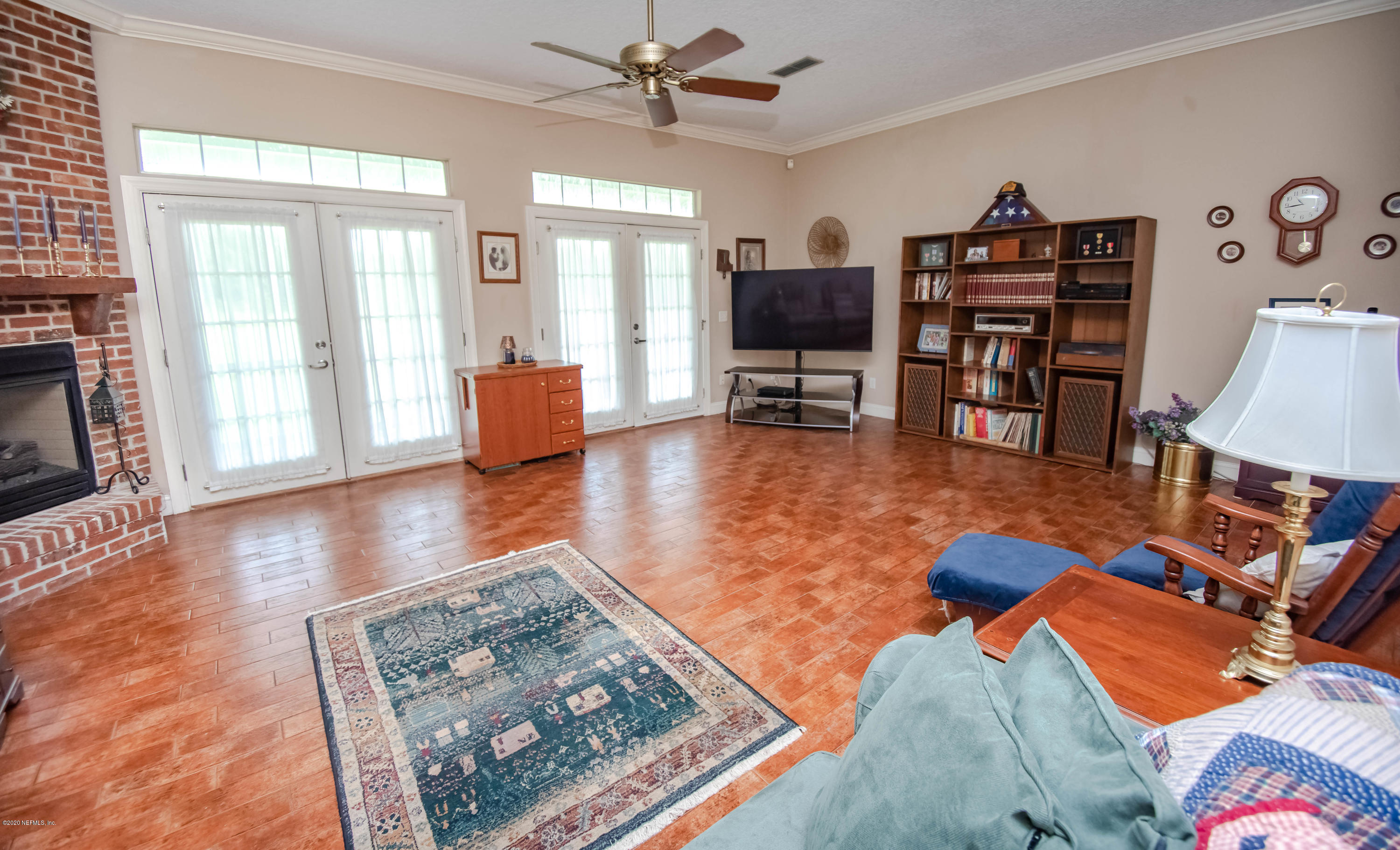 8219 Mud Lake Road Macclenny, FL 32063 - Photo 18 of 63 a living room with furniture and a flat screen tv