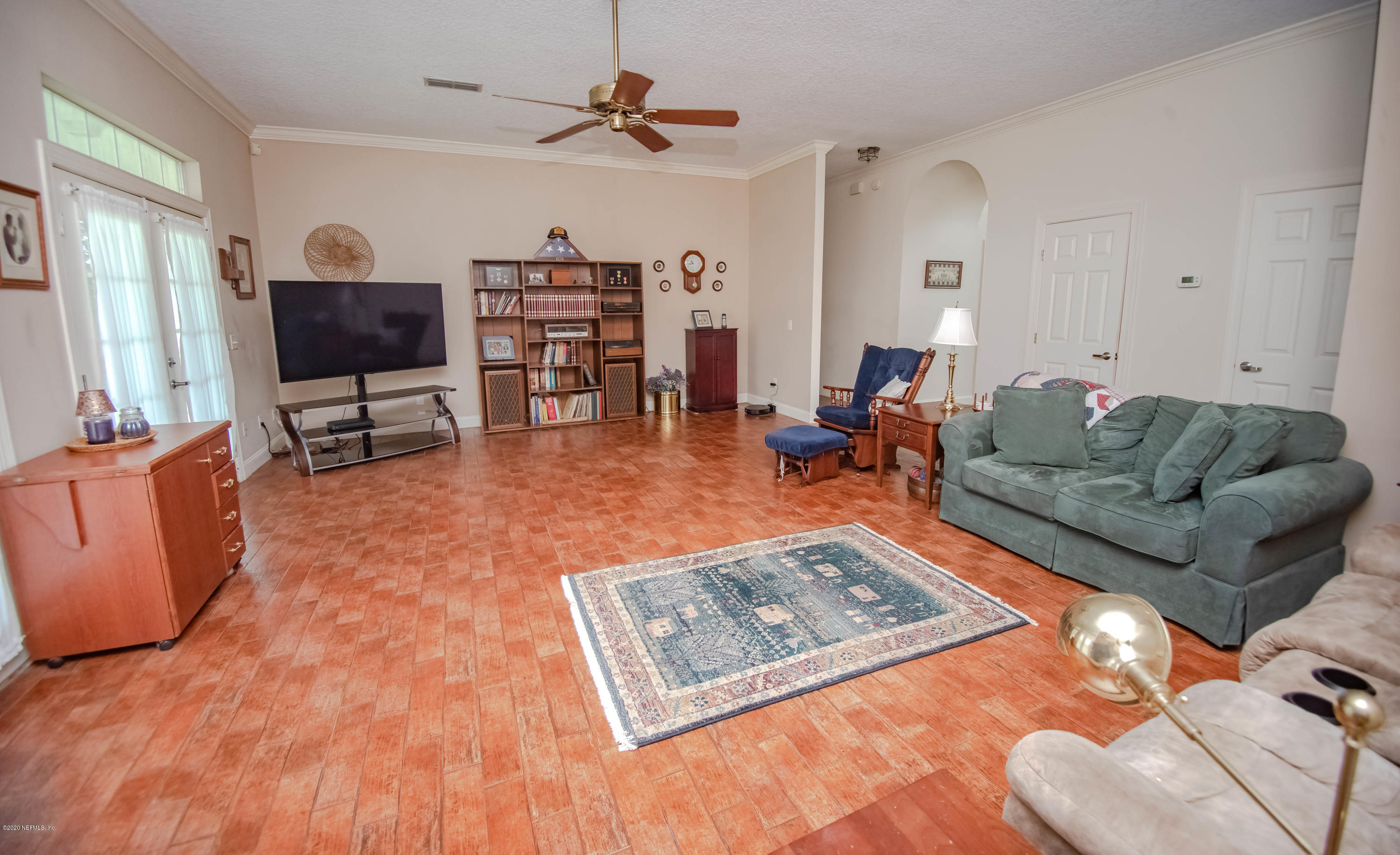 8219 Mud Lake Road Macclenny, FL 32063 - Photo 19 of 63 a living room with furniture and a flat screen tv