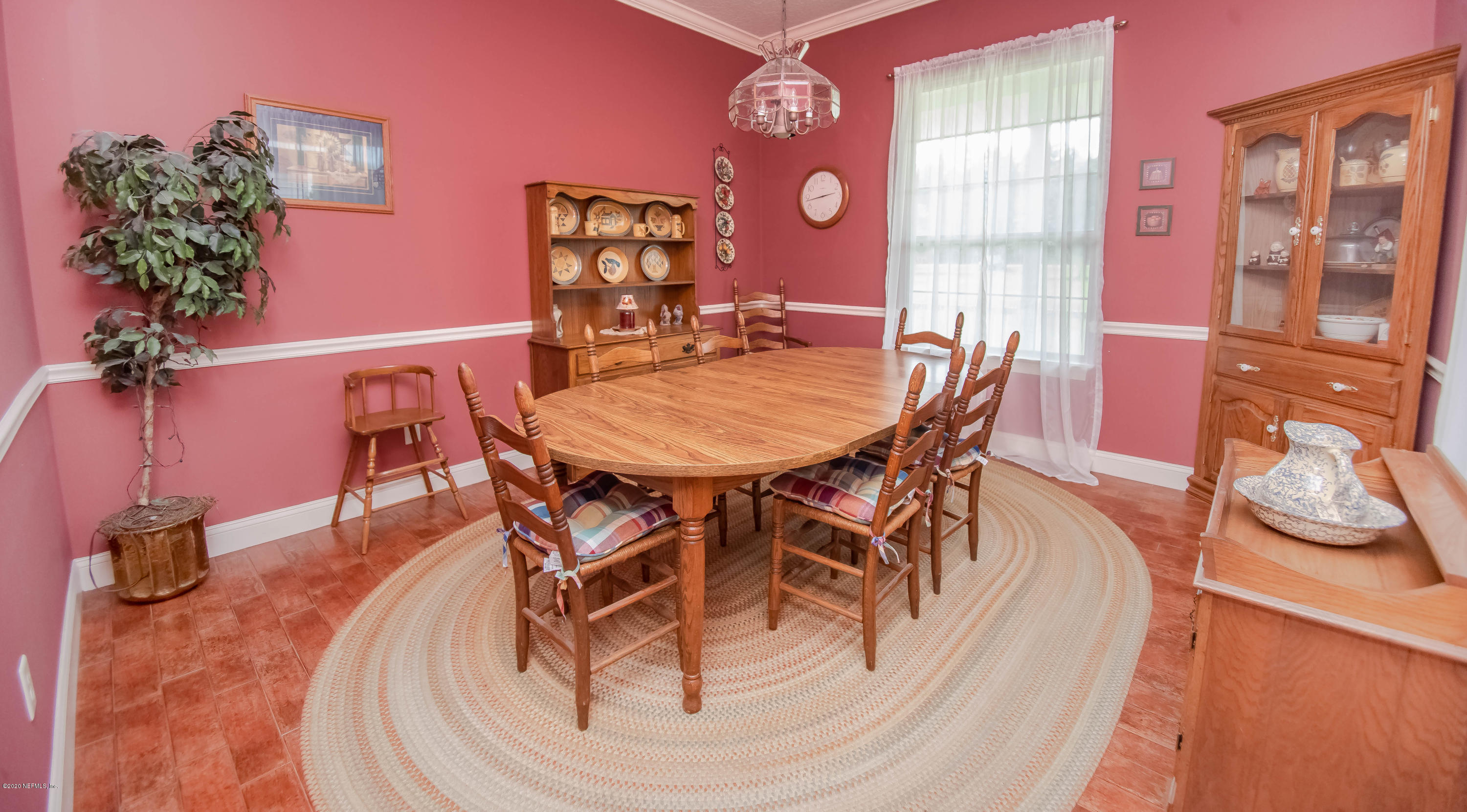 8219 Mud Lake Road Macclenny, FL 32063 - Photo 21 of 63 a dining room with furniture and wooden floor