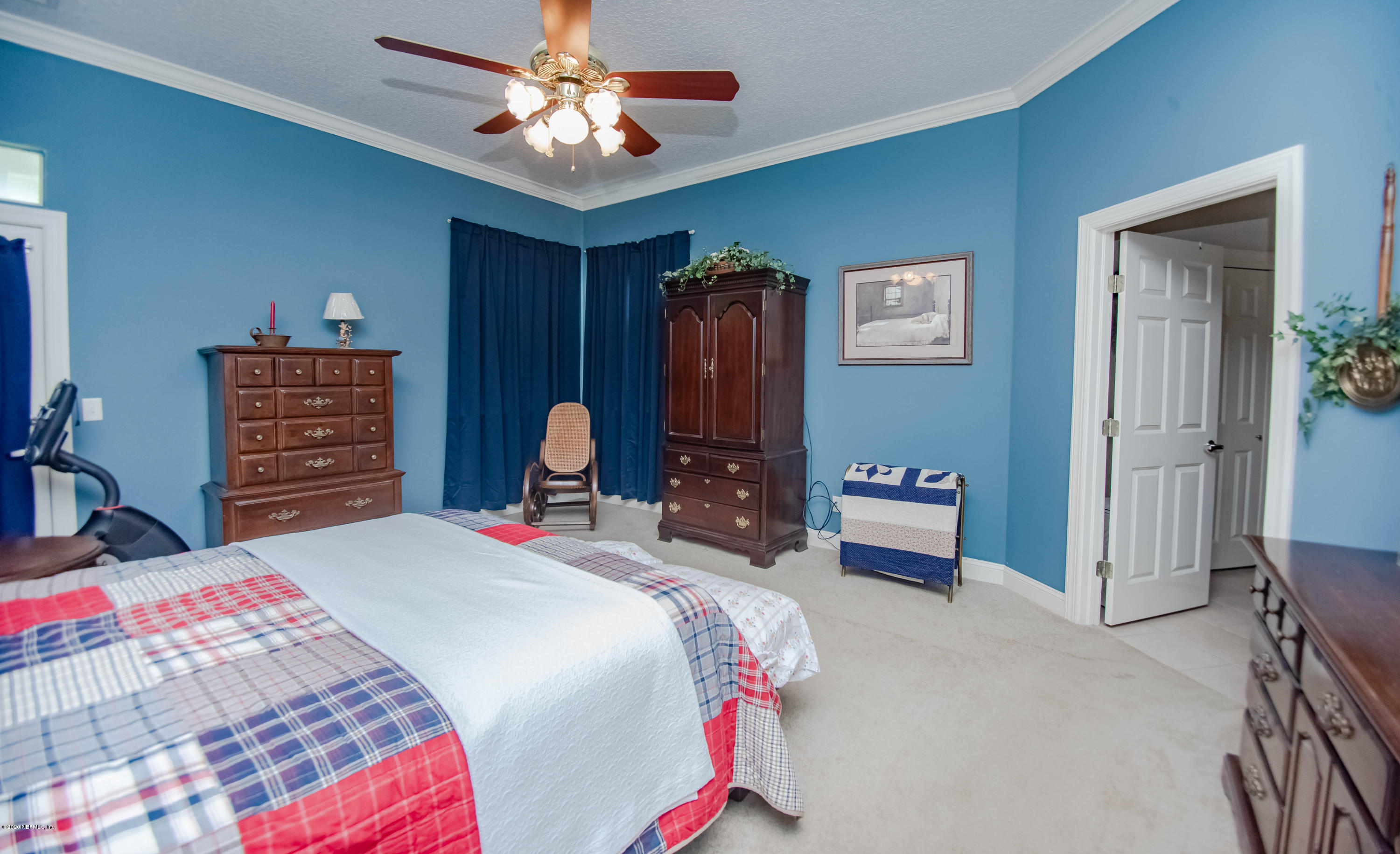 8219 Mud Lake Road Macclenny, FL 32063 - Photo 27 of 63 a bedroom with a bed and a closet