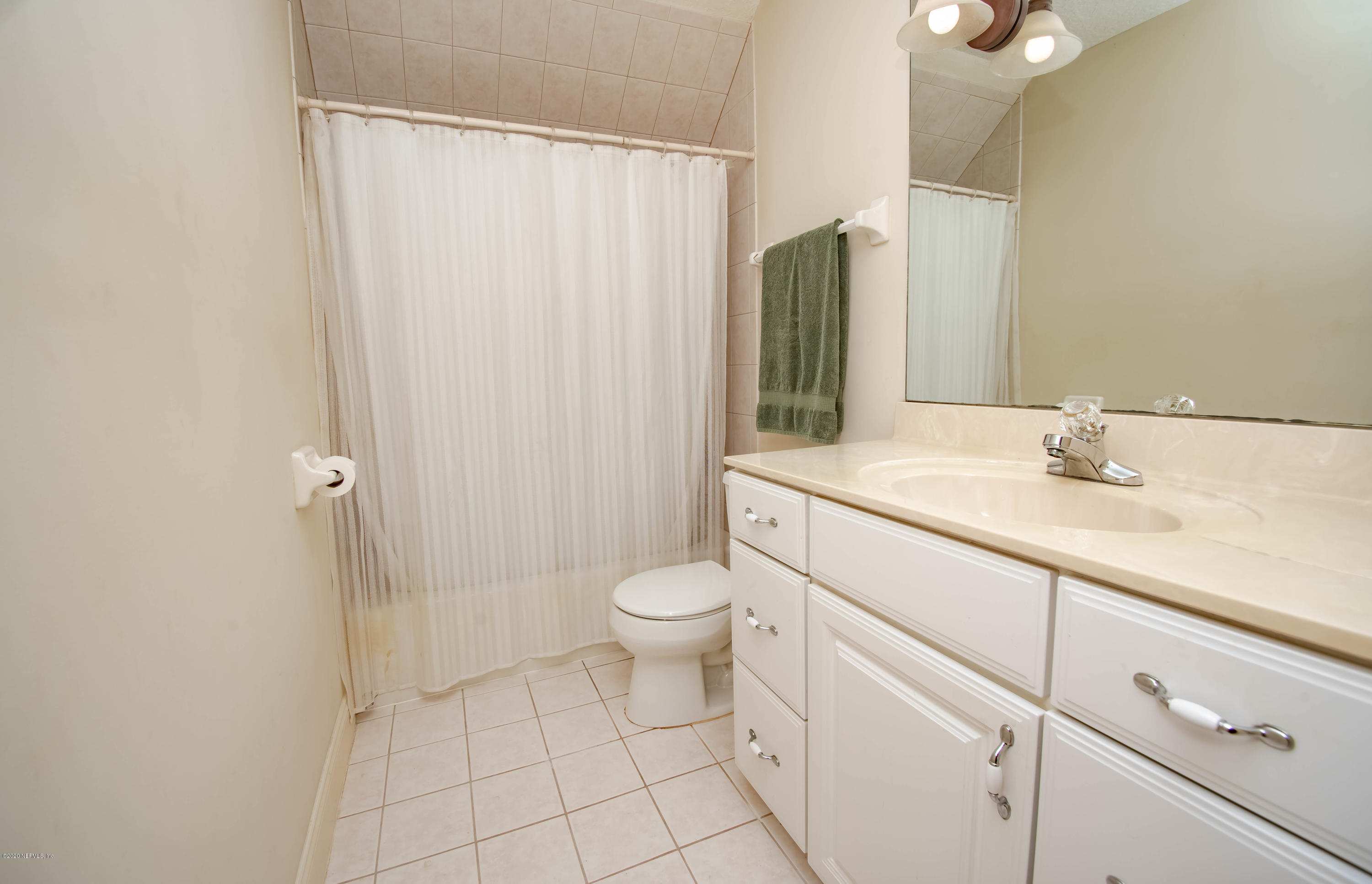 8219 Mud Lake Road Macclenny, FL 32063 - Photo 38 of 63 a bathroom with a sink a toilet and shower