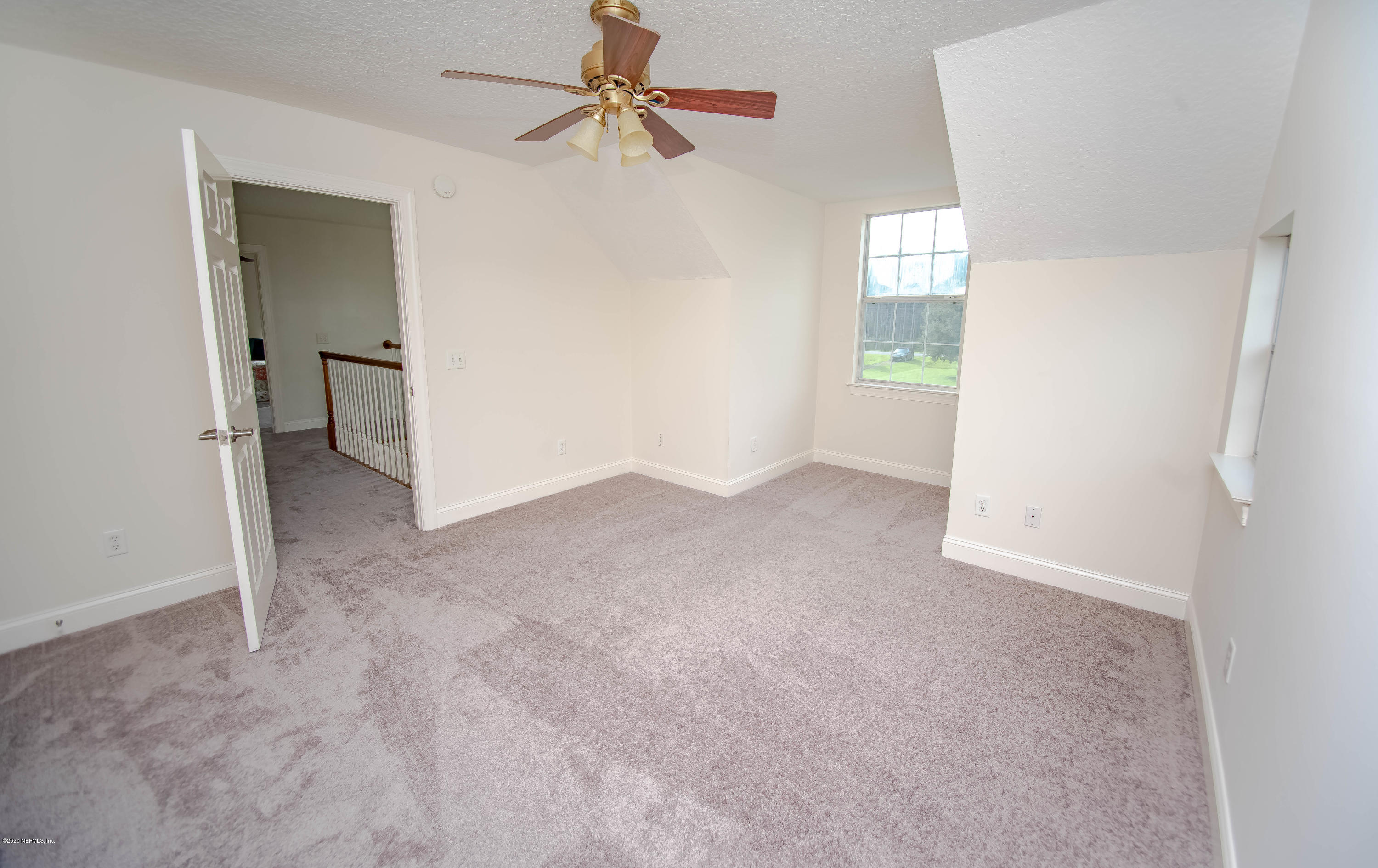 8219 Mud Lake Road Macclenny, FL 32063 - Photo 40 of 63 a view of a big room with closet and chandelier fan
