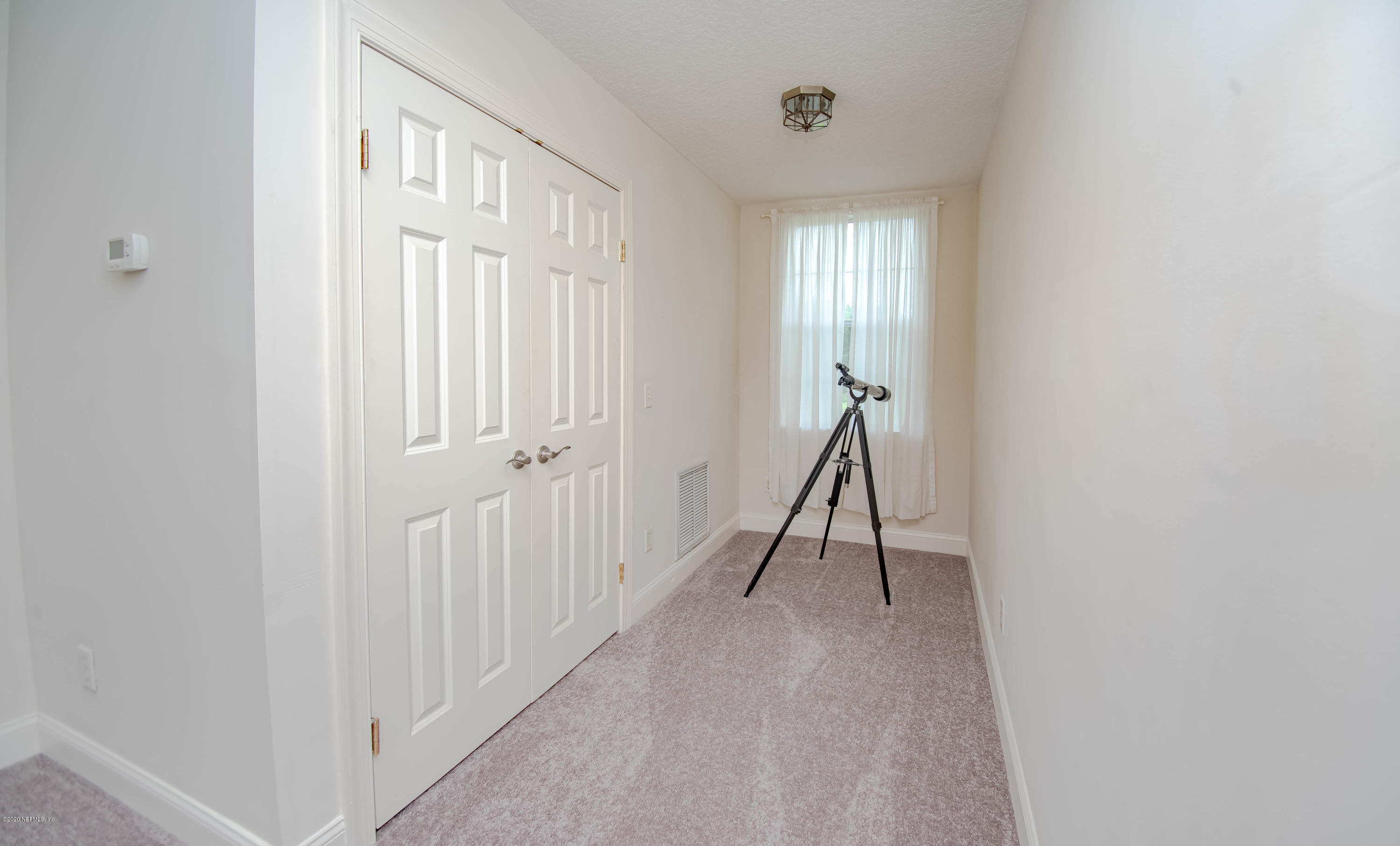 8219 Mud Lake Road Macclenny, FL 32063 - Photo 41 of 63 a view of a livingroom with a staircase