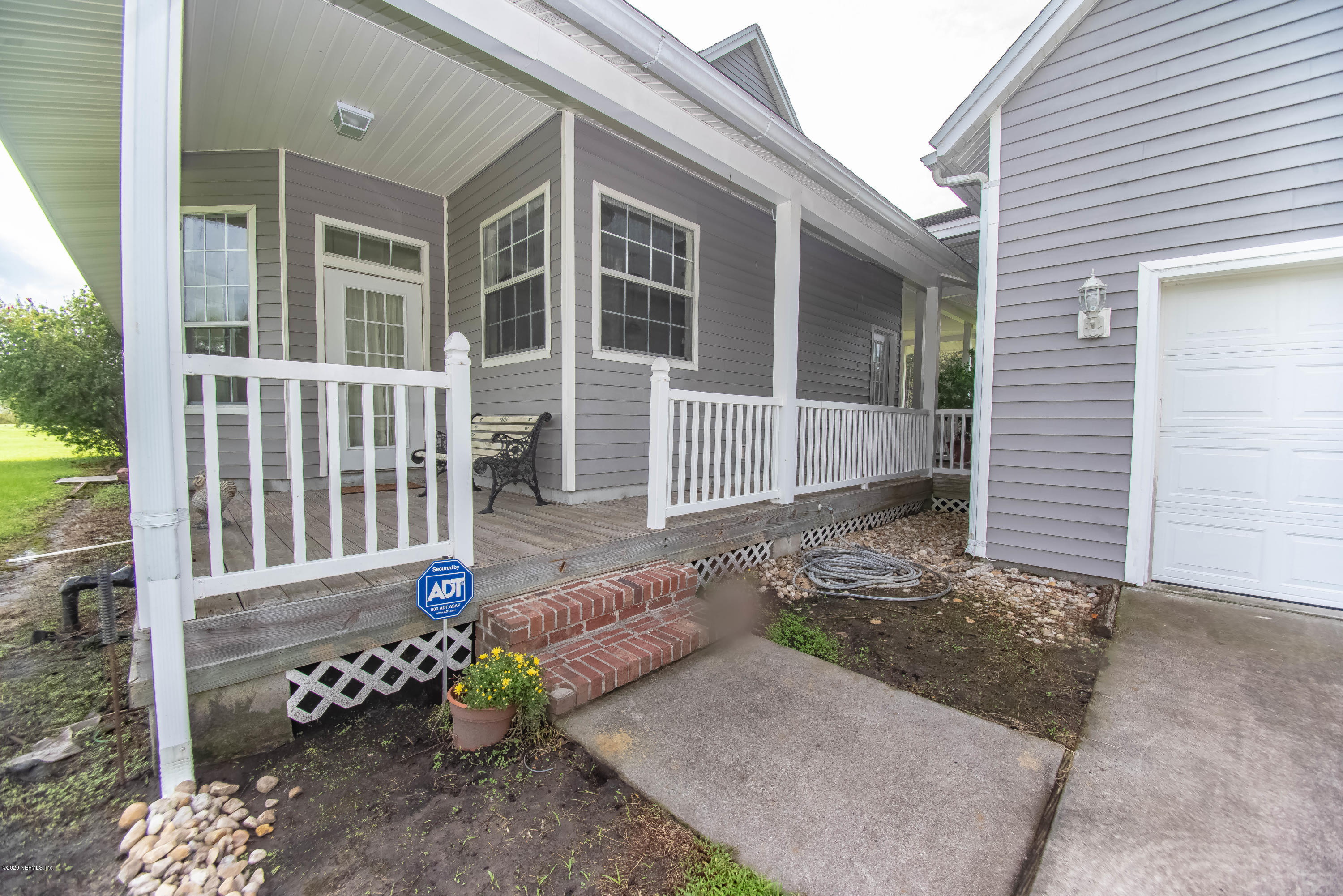 8219 Mud Lake Road Macclenny, FL 32063 - Photo 44 of 63 a view of a house with a yard
