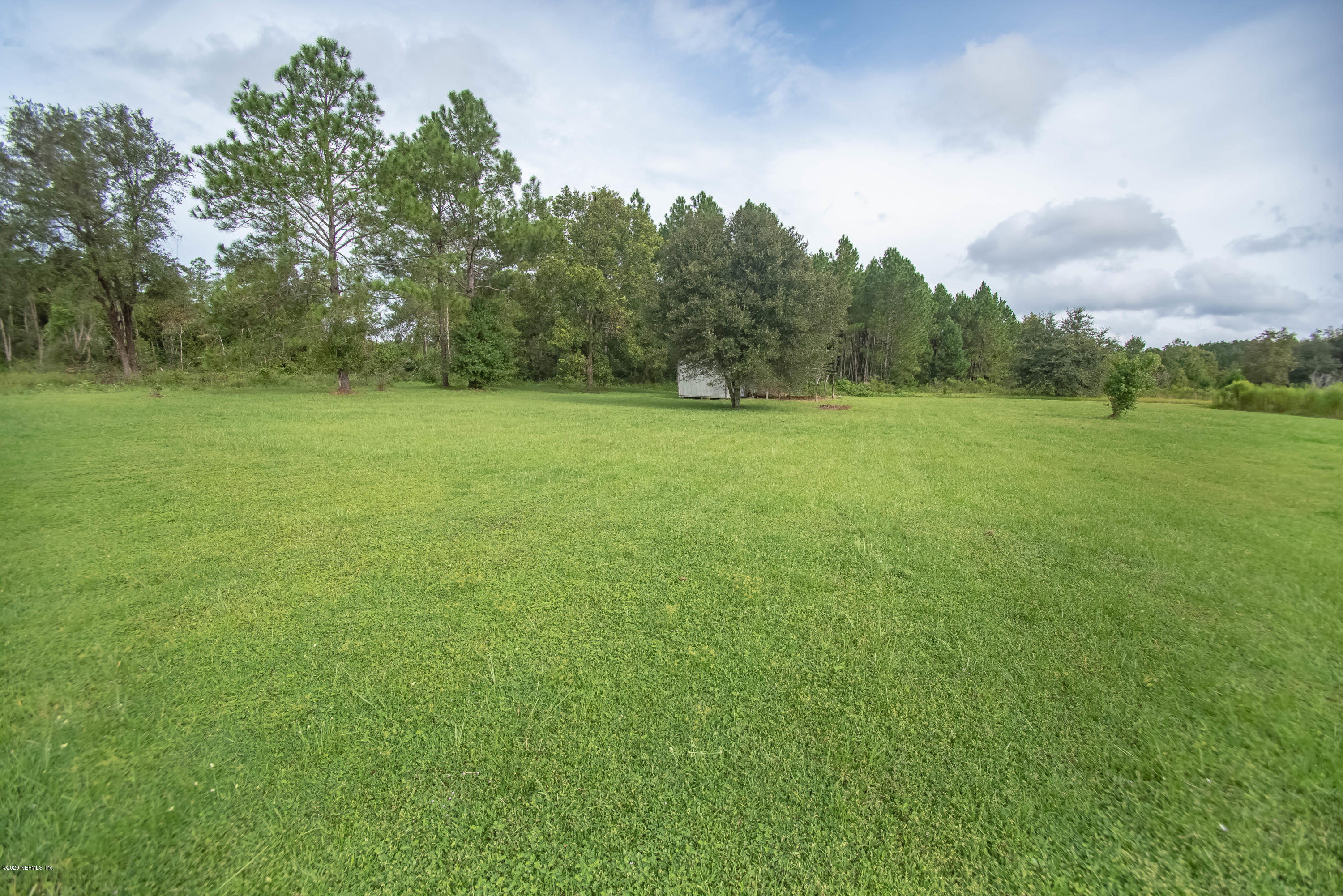 8219 Mud Lake Road Macclenny, FL 32063 - Photo 49 of 63 a view of field with trees in the background