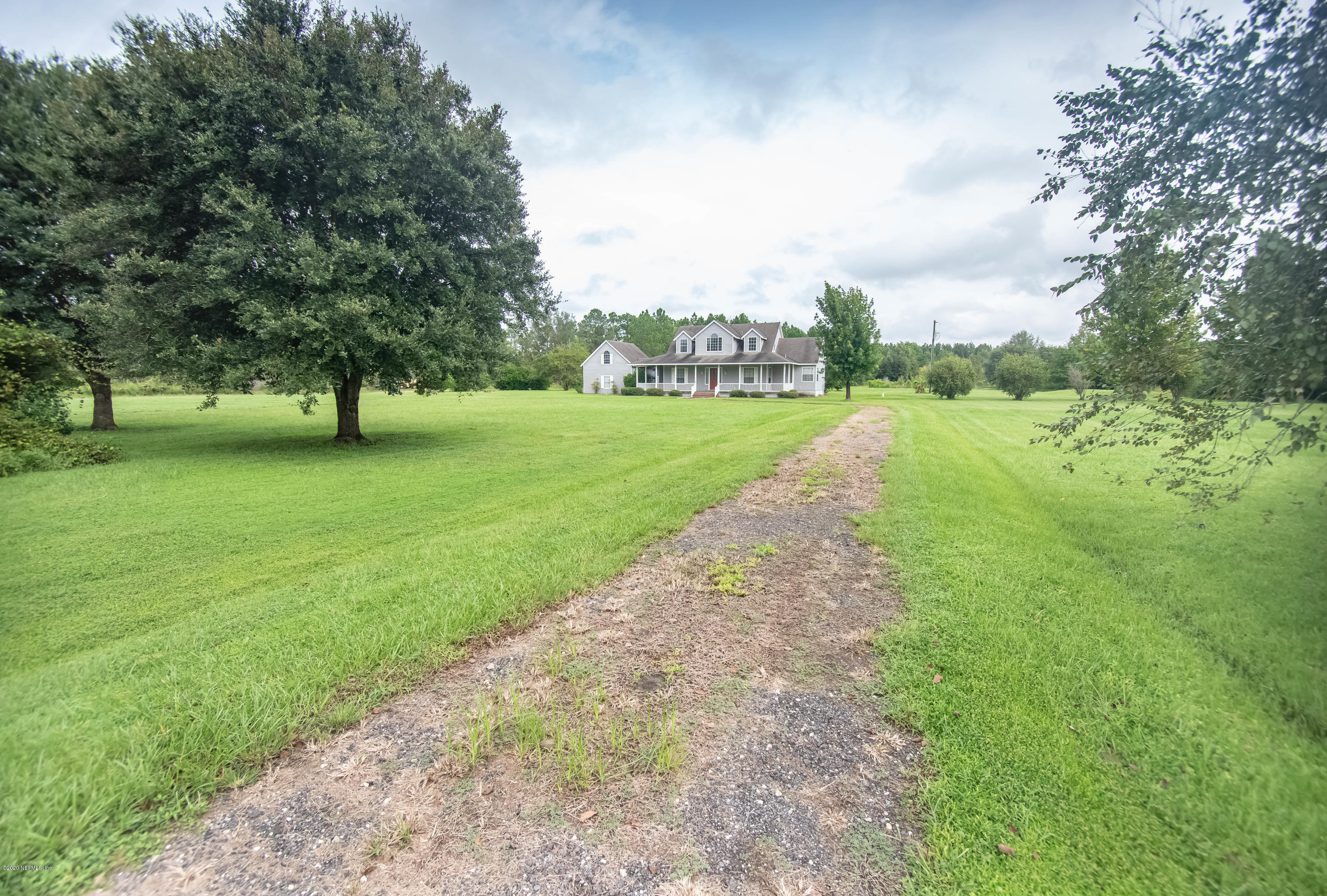 8219 Mud Lake Road Macclenny, FL 32063 - Photo 5 of 63 a view of a green yard