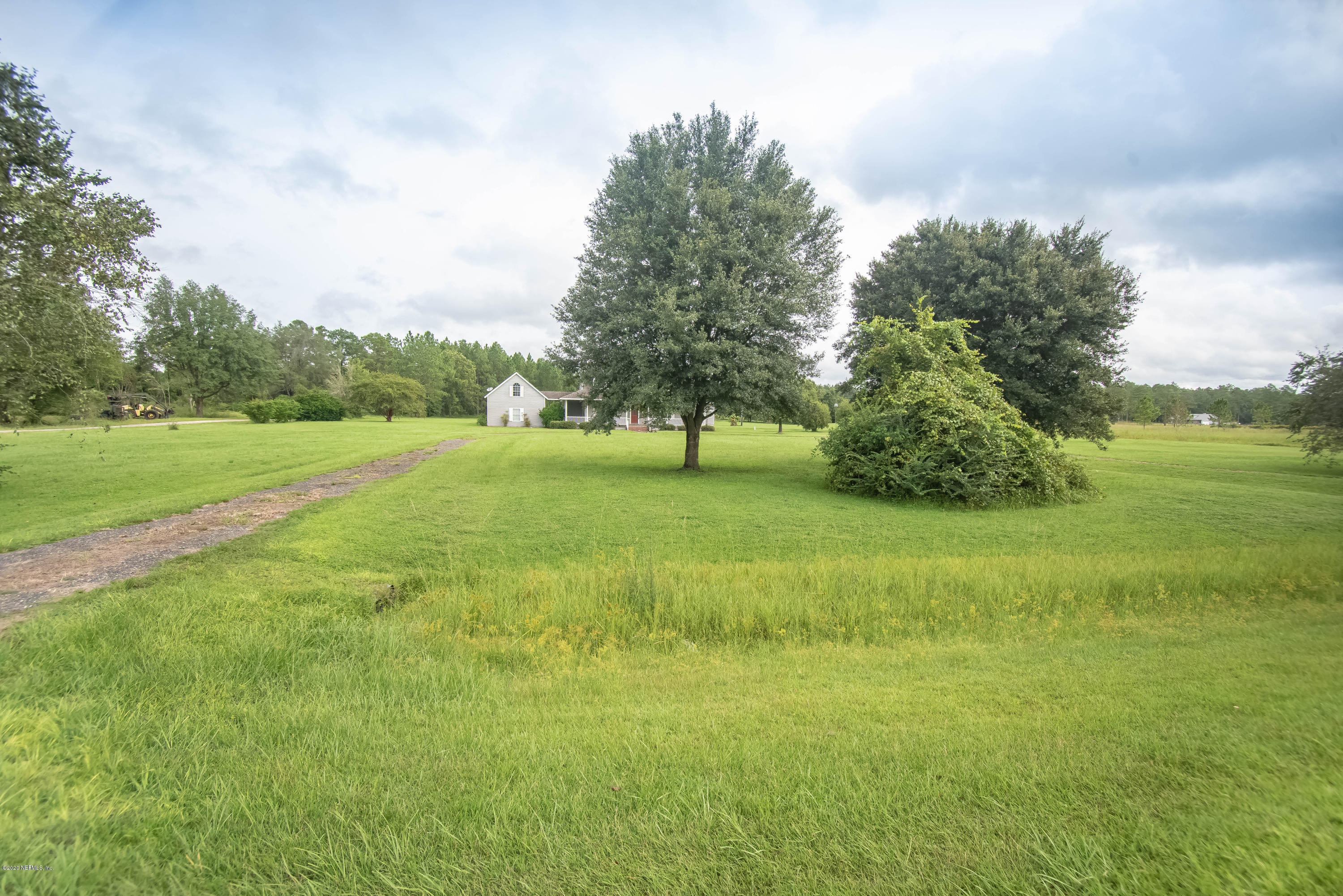 8219 Mud Lake Road Macclenny, FL 32063 - Photo 9 of 63 a view of field with trees in the background