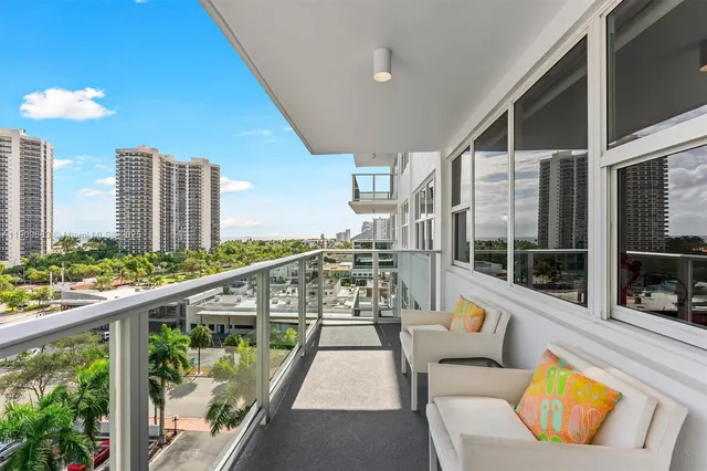 a large kitchen with stainless steel appliances kitchen island granite countertop a sink and cabinets