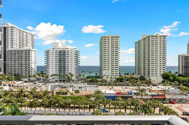 a large kitchen with stainless steel appliances kitchen island granite countertop a sink and cabinets