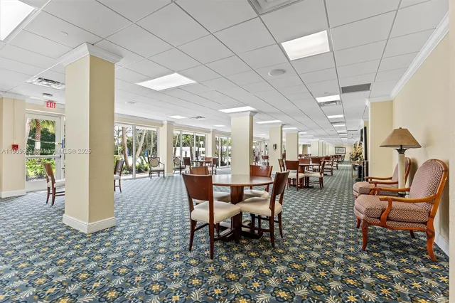 a room with gym equipment and large window