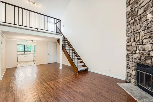 a view of an entryway with wooden floor