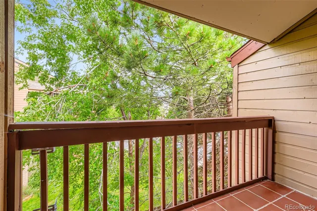 a view of a balcony with wooden floor