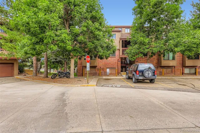 a view of a parked cars in front of a house