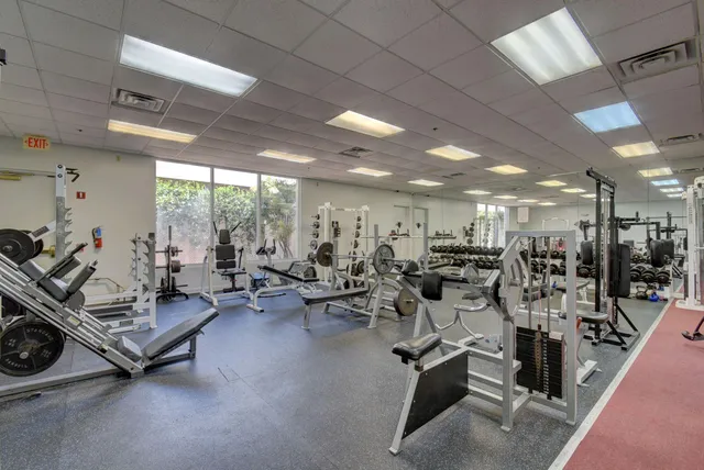a room with gym equipment and a large window