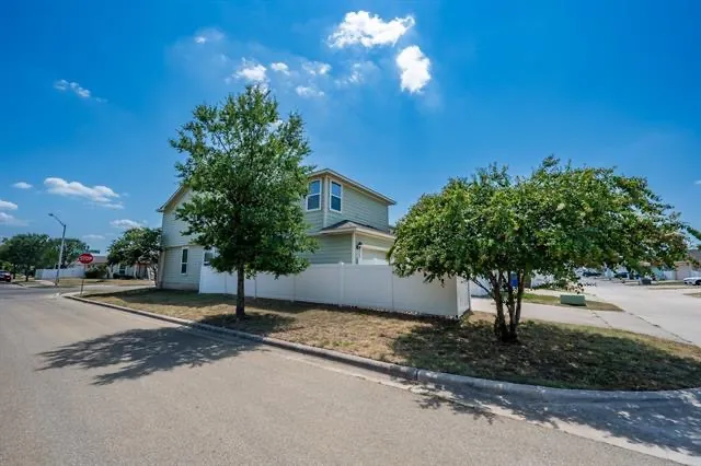 a view of a house with a street